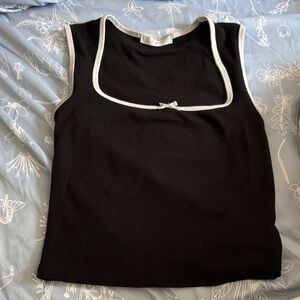 Black Sleeveless Kids Top with White Trim
